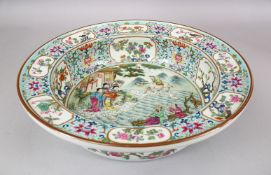 A LARGE CHINESE FAMILLE ROSE PORCELAIN BASIN, with panel decoration, of native floral decoration and
