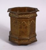 A 19TH CENTURY ISLAMIC SPANISH BRONZE OCTAGONAL MORTAR, with engraved motif, 10cm x 8.5 wide.