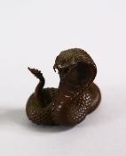 A JAPANESE BRONZE FIGURE OF A COBRA SNAKE, marked underside, 4.5cm.