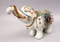 A GOOD JAPANESE MEIJI PERIOD KUTANI PORCELAIN ELEPHANT FIGURE, the figure in a striding pose with