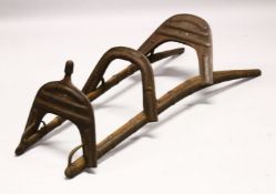 A LARGE WOOD & METAL POSSIBLY EGYPTIAN CAMEL SADDLE / SEAT, the timbers enclosed and decorated