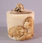 A JAPANESE MEIJI PERIOD CARVED IVORY LIDDED TUSK POT- carved with elephants and monkeys to the side,