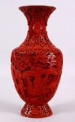 A 19TH / 20TH CENTURY CHINESE CINNABAR LACQUER VASE, decorated with figures in a landscape with