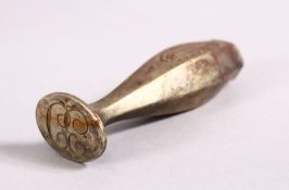 A SILVER METAL SEAL STAMP, the base possibly carved with carved with 