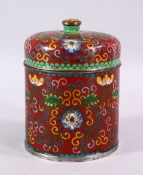 A 19TH / 20TH CENTURY CHINESE CLOISONNE CYLINDRICAL BOX AND COVER, decorated upon a red ground