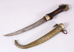 A GOOD ISLAMIC MOROCCAN DAGGER, with a carved gilt metal sheath, and carved wood handle, 40cm