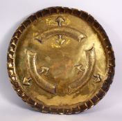 A 19TH CENTURY ISLAMIC TURKISH BRASS MOULDED CALLIGRAPHIC DISH, with moulded bands of calligraphy