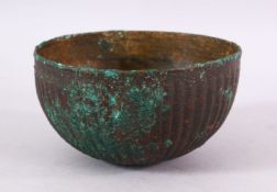 AN EARLY PERSIAN POSSIBLY SASSANIAN OR AKHAMINID BRONZE BOWL, with a ribbed body, 15cm