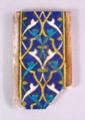 A 15TH CENTURY PERSIAN OR CENTRAL ASIAN TIMURID CUERDA SECA TILE, the tile with stylized motif
