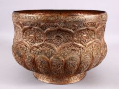 A 19TH CENTURY KASHMIRI EMBOSSED COPPER BOWL - with embossed decoration in relief of floral motif,