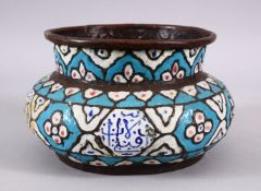 A 19TH CENTURY ISLAMIC TURKISH ENAMEL CALLIGRAPHIC BASIN, with a blue ground and panels of