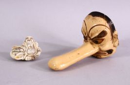 TWO JAPANESE MEIJI PERIOD PORCELAIN NETSUKE, one of a seated figure of hotei, with his sack of