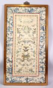 A 19TH CENTURY CHINESE EMBROIDERED PICTURE OF FIGURES IN LANDSCAPES AND NATIVE FLORA, Framed 17cm