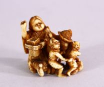 A JAPANESE MEIJI PERIOD CARVED IVORY NETSUKE - LADY & CHILDREN WITH ONI'S - the lady and children