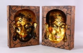 A PAIR OF GILDED CHINESE MASK MOULDS OF BUDDHA, 31CM X 24CM