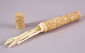 A 19TH CENTURY CHINESE CARVED IVORY CANTON ETUI - NEEDLE CASE, carved in deep relief to depict