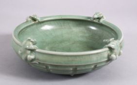 A CHINESE SONG STYLE CELADON MOULDED CHILONG BOWL, with moulded chilong to the rim, boss to the