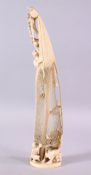 A JAPANESE MEIJI PERIOD CARVED IVORY OKIMONO OF SAIL MAKER - carved with a large sail with a