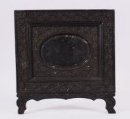AN ISLAMIC INDIAN CEYLONESE CARVED EBONY PHOTO FRAME, carved with floral scroll, 24cm x 25.5