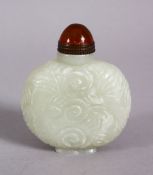 A CHINESE CARVED JADE SNUFF BOTTLE, carved with floral swirl decoration,with a hard stone stopper,