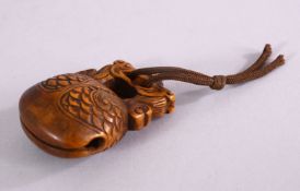 A JAPANESE MEJI PERIOD CARVED BOXWOOD NETSUKE OF MOKUGYO - DRAGON & BELL - carved with two dragons