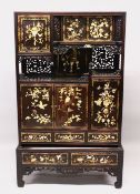 A JAPANESE MEIJI PERIOD SIGNED SHIBAYAMA INLAID CABINET ON STAND, the panels carved inlaid with