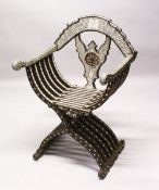 A GOOD 19TH CENTURY MOTHER INLAID & HARDWOOD FOLDING MOORISH ARM CHAIR, profusely inlaid with mother