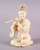 A 19TH CENTURY CHINESE CARVED IVORY FIGURE OF GUANYIN, in a seated position playing her musical