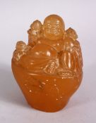 A CHINESE CARVED HARDSTONE FIGURE OF SEATED BUDDHA, in a seated position with boys 10cm