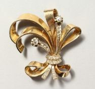 A YELLOW GOLD AND DIAMOND SET SPRAY BROOCH.