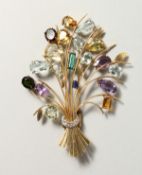 A VERY SUBSTANTIAL YELLOW GOLD BROOCH set with precious stones.