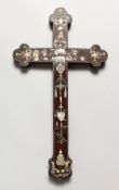 A CHINESE ROSEWOOD CRUCIFIX, with mother-of-pearl inlaid floral decoration. 18.25ins x 10.25ins.