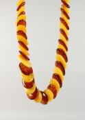 A TWO-COLOUR FAUX-AMBER NECKLACE.