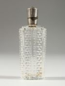 A CUT GLASS SILVER TOP SCENT BOTTLE. 9cms long.