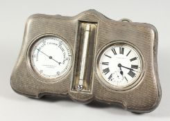 A MAPPIN & WEBB ENGINE TURNED SILVER WATCH, BAROMETER AND THERMOMETER SET. 9ins long x 5ins high.