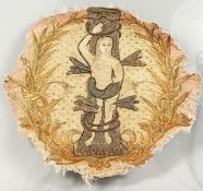 A CIRCULAR SILKWORK PICTURE, depicting Eve (?), mounted onto glass. Silkwork: 18ins diameter.