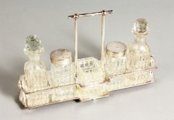 A SILVER PLATED FIVE-PIECE CRUET SET.