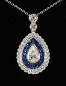 A SUPERB 18CT WHITE GOLD, SAPPHIRE AND DIAMOND PENDANT on a chain.
