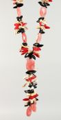 A ROSE QUARTZ, CORAL AND JET NECKLACE.