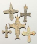 FIVE ROMAN METAL CROSSES. 7cms - 9cms.