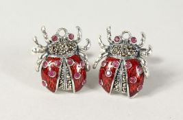 A PAIR OF SILVER AND ENAMEL RUBY SET LADYBIRD CUFFLINKS.