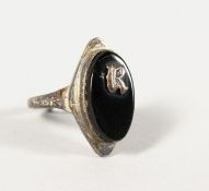 A JET RING with initial R.