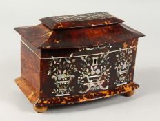 A GOOD REGENCY TORTOISESHELL TWO DIVISION BOW FRONT TEA CADDY with mother-of-pearl inlay, on four