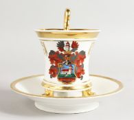 A BERLIN ARMORIAL CUP AND SAUCER.