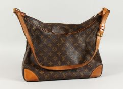 A LOUIS VUITTON BAG with long leather handle. 14ins long.