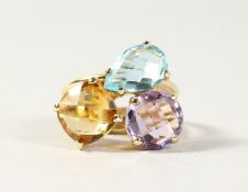 A MATCHING AMETHYST, TOPAZ AND CITRINE RING.