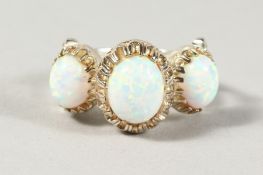 A SILVER THREE STONE GILSON OPAL RING.