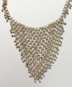 AN ISLAMIC SILVER METAL CHAIN.