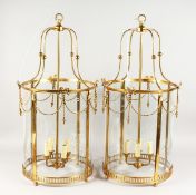 A GOOD LARGE PAIR OF BRASS AND GLASS CIRCULAR LANTERNS.