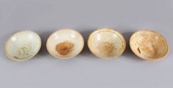 A LOT OF FOUR EARLY CHINESE POTTERY BOWLS, some glazed some unglazed. largest 15.5cm diameter.